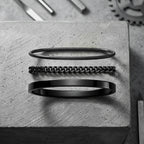 Silver bracelets on slate background