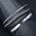 Black bracelet set on concrete block
